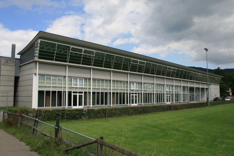 http://commons.wikimedia.org/wiki/Category:Buildings_in_Wettingen#mediaviewer/File:Wettingen_Sporthalle_Taegi_8408.jpg